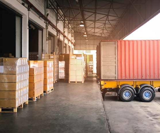 Containers being loaded with hygiene products for shipment
