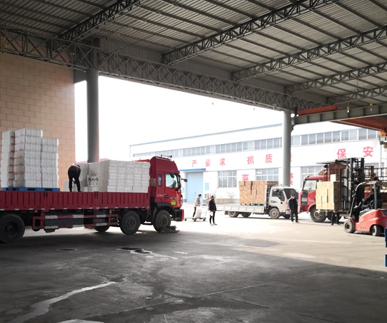 Delivery truck loading rolls of toilet paper at Top Source Hygiene