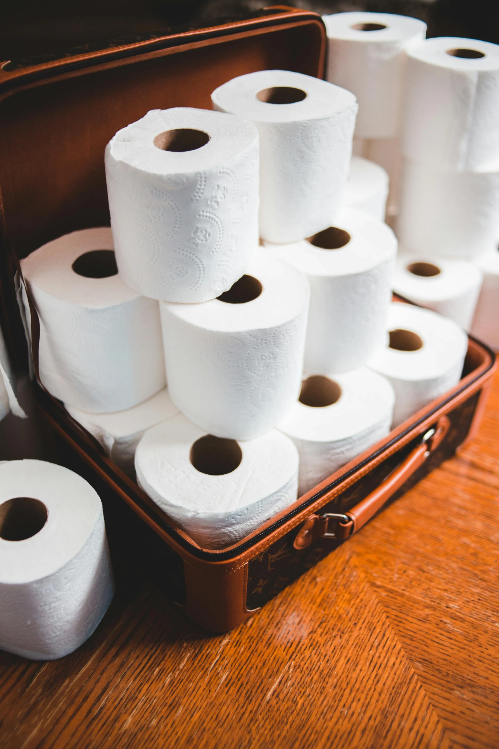 Heap of white toilet paper rolls stacked symmetrically