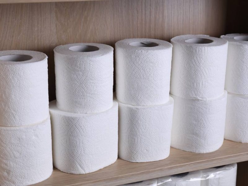Stacked,Toilet,Paper,Rolls,On,Wooden,Shelf