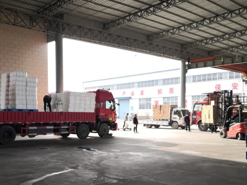 Delivery truck loading rolls of toilet paper at Top Source Hygiene