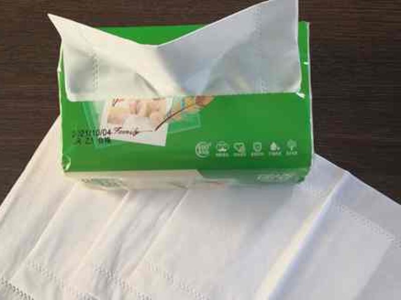 White soft facial tissue in a branded hotel box for hygiene use